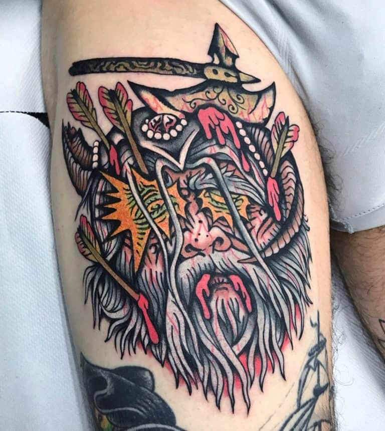 witcher tattoo of face with axe in head