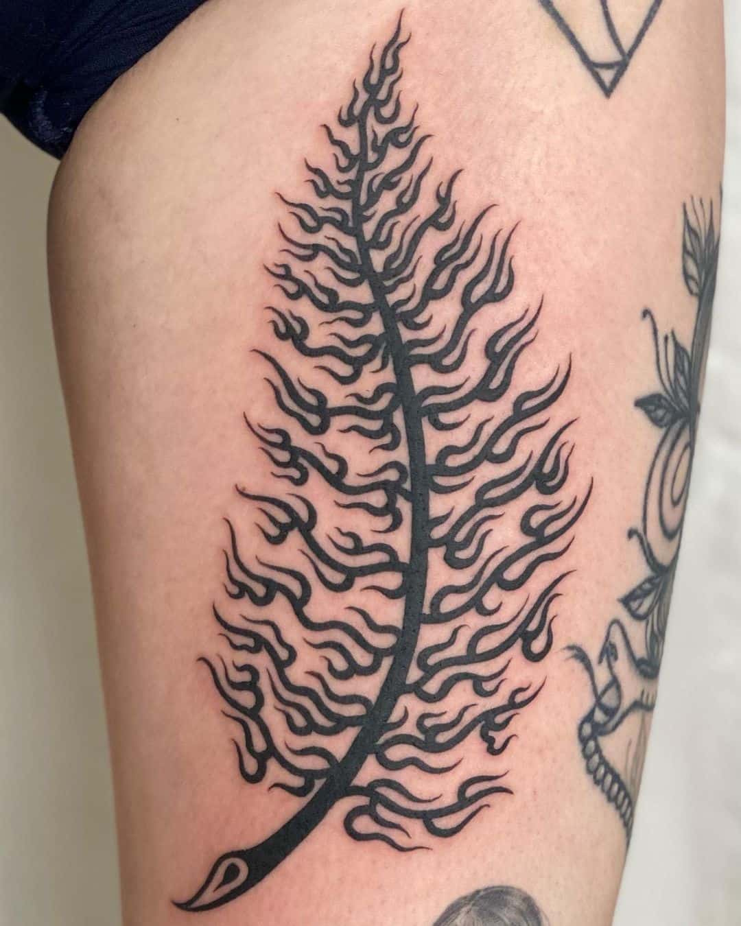 Woman with fern tattoo hugging trees and enjoying nature in the pine forest  Stock Photo - Alamy
