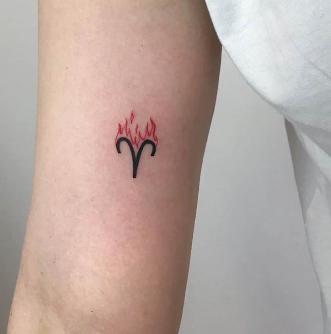 aries symbol tattoo behind ear