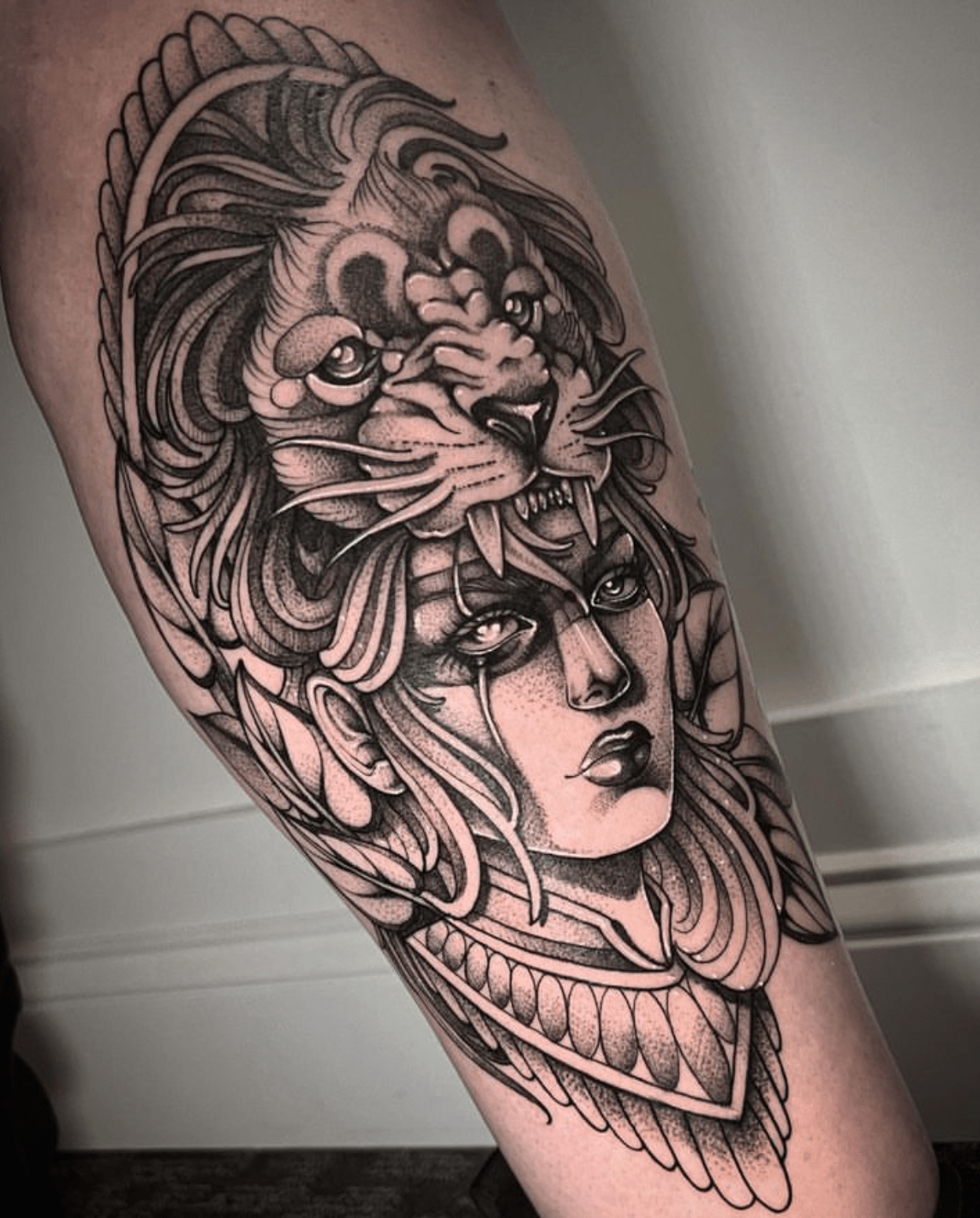 Matching continuous line lioness and lion tattoo.