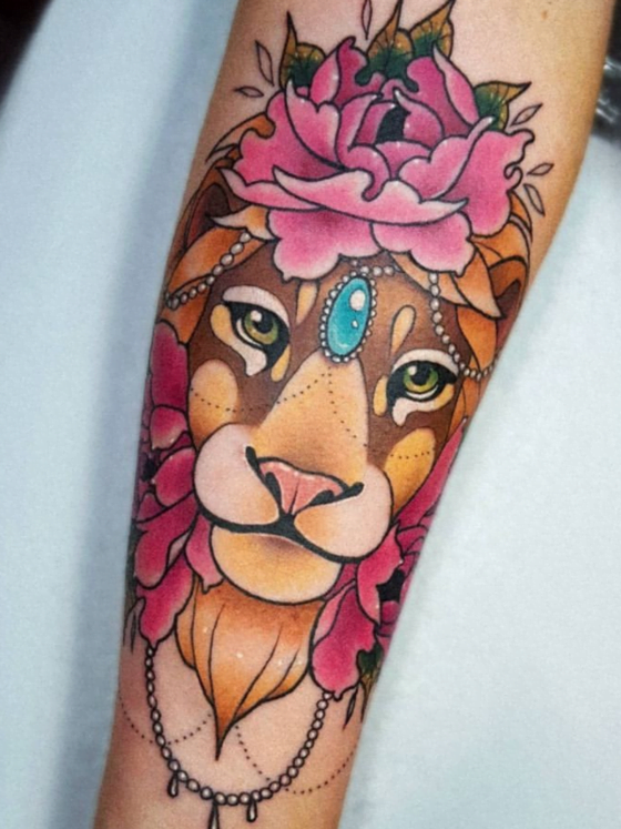 30 Leo Tattoos To Roar About 8 arm tattoo of vivid colored lion with jewels and flowers