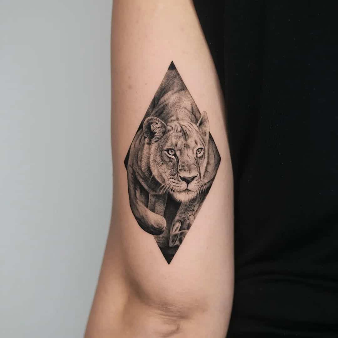 Hyper-realistic lion tattoo - Tattoogrid.net