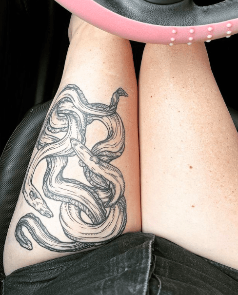 girls thigh tattoo