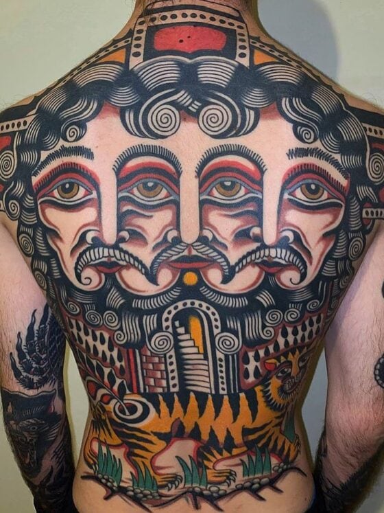 27 Bold Back Tattoos For Men To Make A Statement 8 man with abstract face tattoos on his back