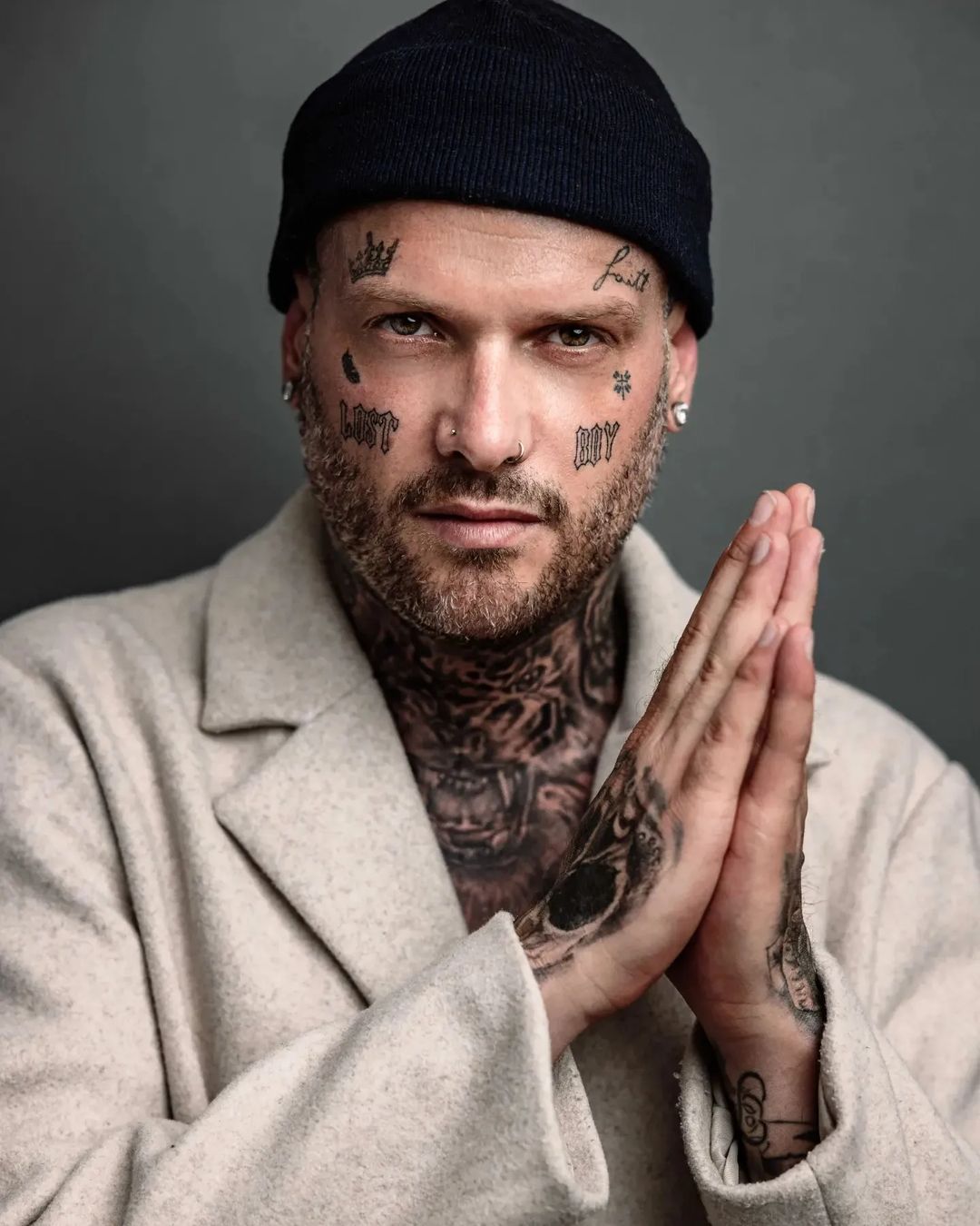 Praying Shaved Head Man with Tattoos on His Arm. Stock Photo - Image of  confident, businessman: 116321528