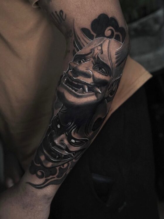 21 Hauntingly Beautiful Hannya Mask Tattoos 6 two hannya mask tattoos on a mans arm