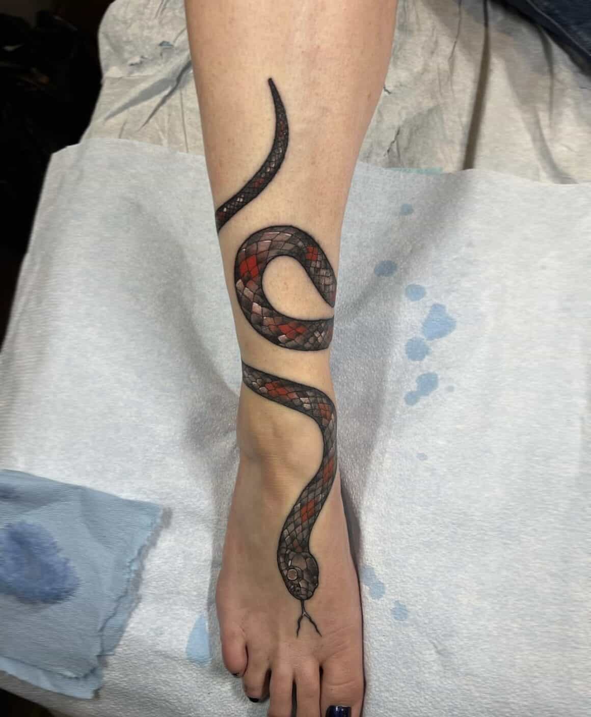 Dagger legs and snake tattoo - Tattoogrid.net