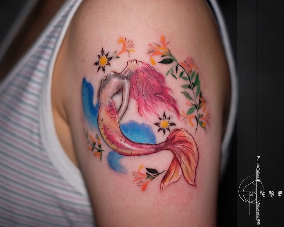 Mermaid Tattoo On Girl's Stomach