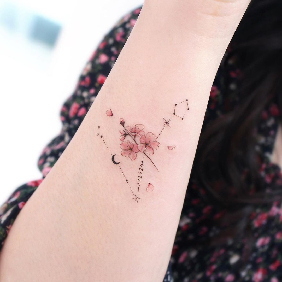 Zodiac sign Pisces tattoo Stock Photo - Alamy